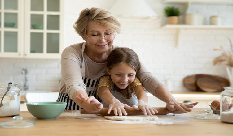 grandmother grandchild baking together