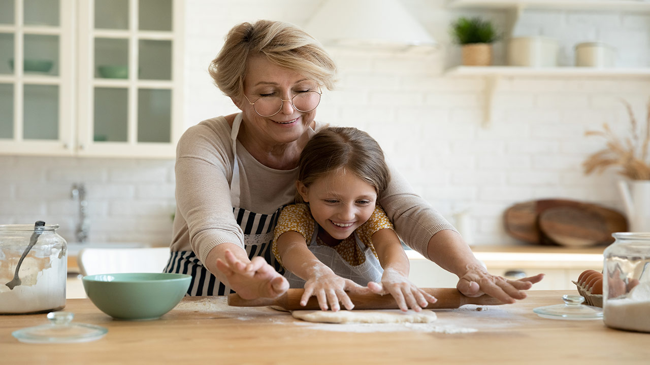 grandmother grandchild baking together