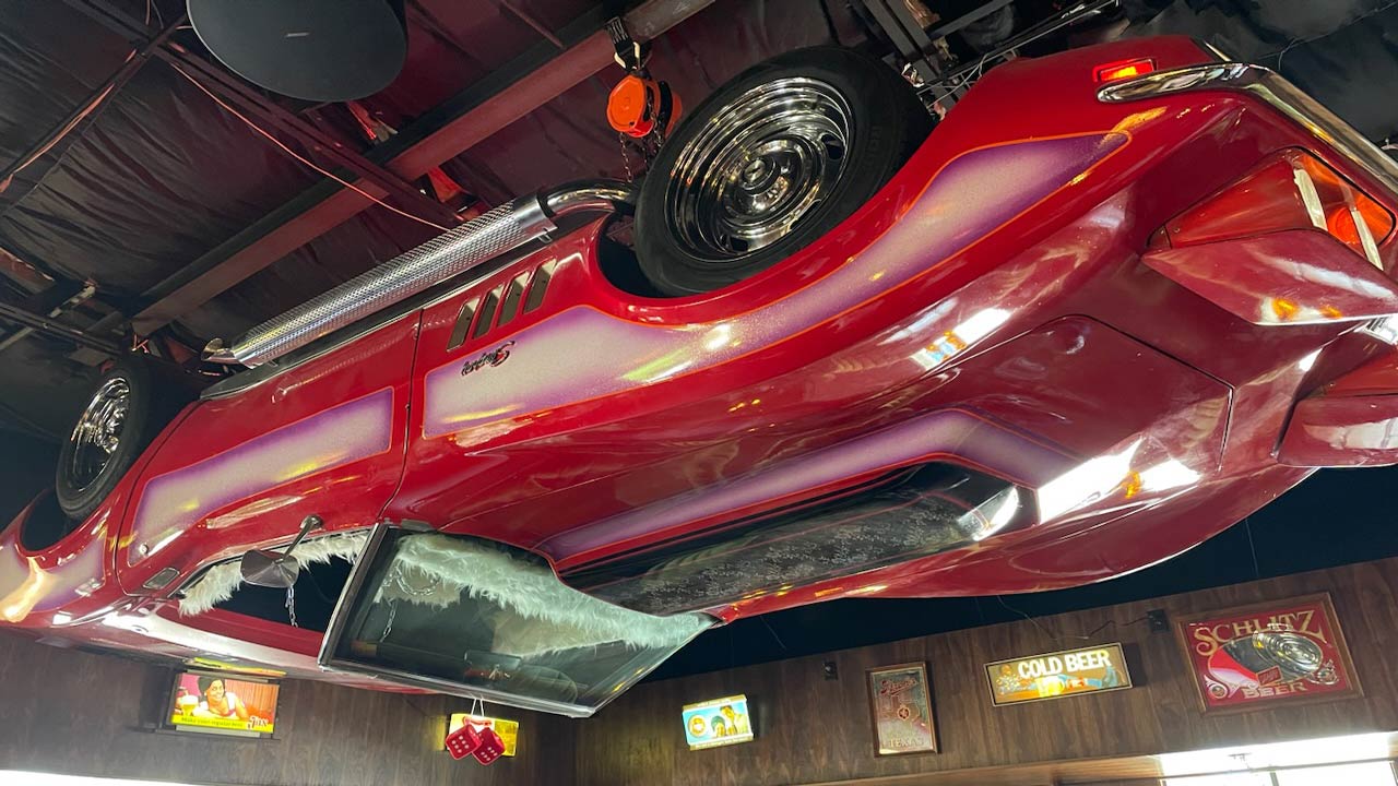 corvette hanging upside down busty's