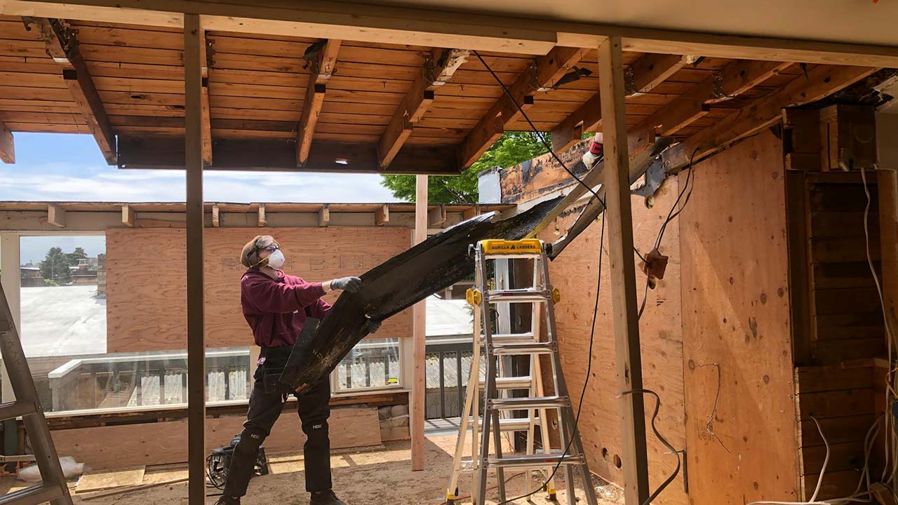 man building a house