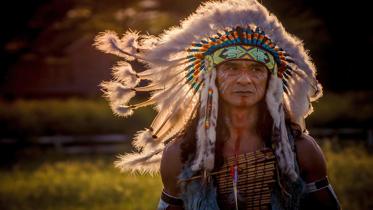 native american man in traditional headdress