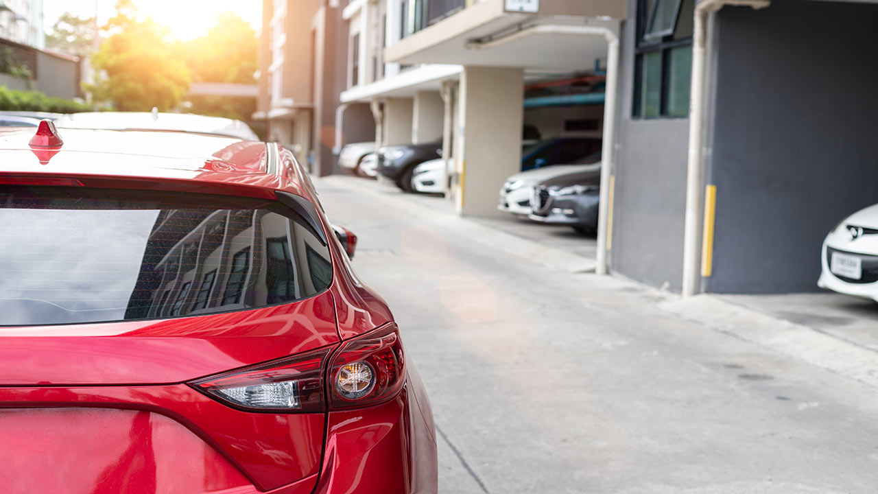 red car parking garage