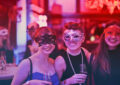 trio of women with masquerade masks