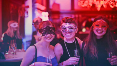 trio of women with masquerade masks