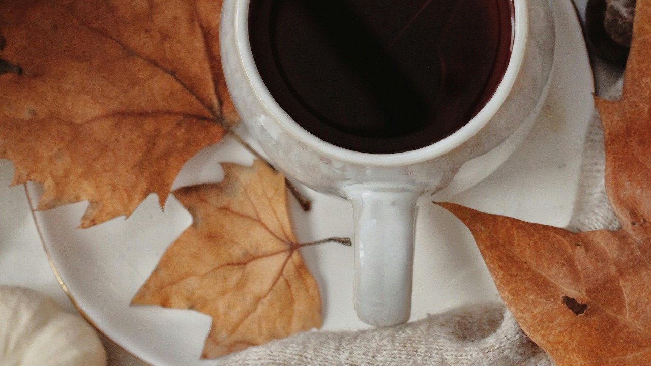 cup of coffee with dry leaves